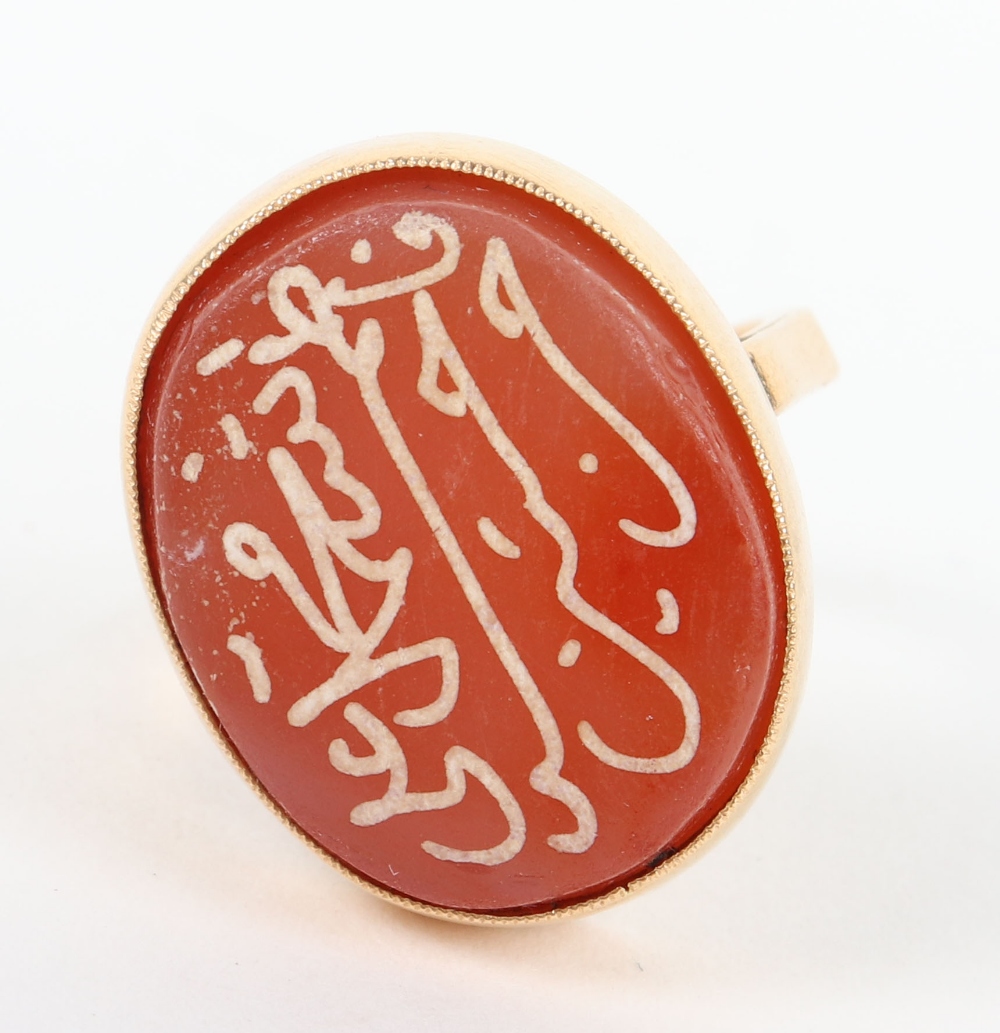 A high carat gold ring with carnelian intaglio seal with Islamic script