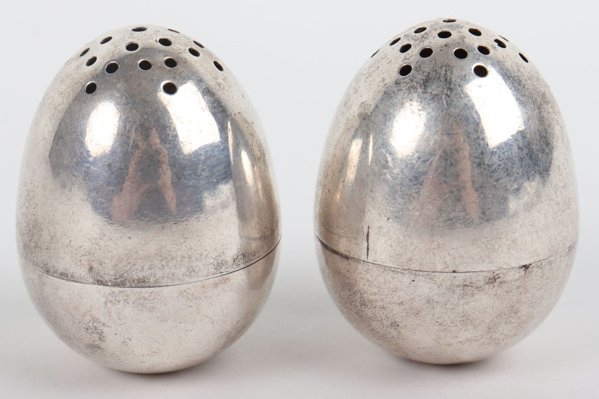 A pair of Victorian silver peppers, London 1878