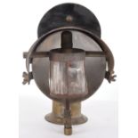 A large railway workers brass lamp, the back plate painted with “locking lineman”