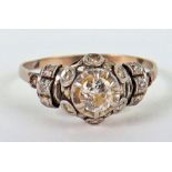 A Continental gold (unmarked) and diamond cluster ring
