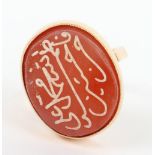 A high carat gold ring with carnelian intaglio seal with Islamic script