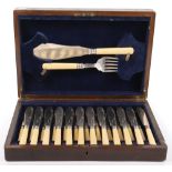 An early 20th century silver plate and bone handle fish knife and fork set for twelve