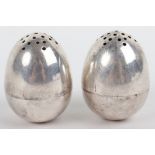 A pair of Victorian silver peppers, London 1878