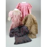 Four dolls dresses,