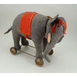 A good grey felt Schuco Roller Yes/No Elephant on wheels, German 1920s,