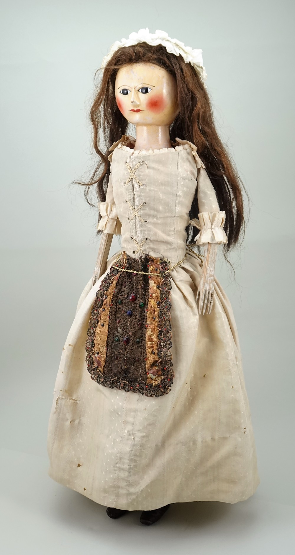A large and important George III wooden doll, English circa 1770,