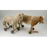 Early Steiff burlap plush Cat on wheels, German circa 1910,