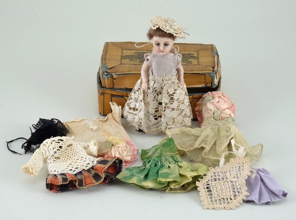 All bisque doll with additional clothes, German circa 1900,