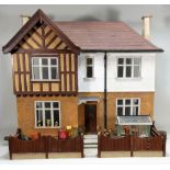A Tudor style dolls house, English 1930s,
