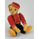 A rare early Schuco Yes/No Bell Hop Teddy bear, circa 1920,