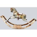 A good and large carved and painted wooden rocking horse on bow rockers, possibly F.H Ayres,