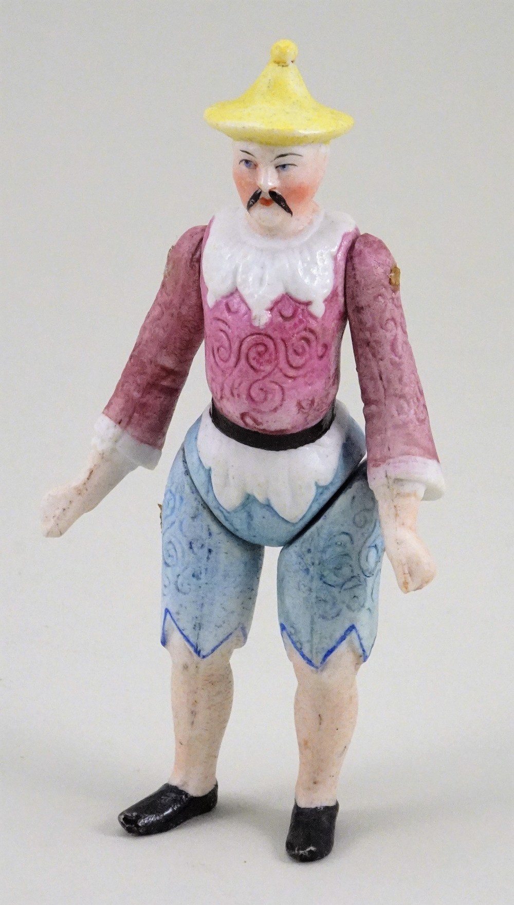 A rare all-bisque Chinaman with moulded clothes, German 1870s,