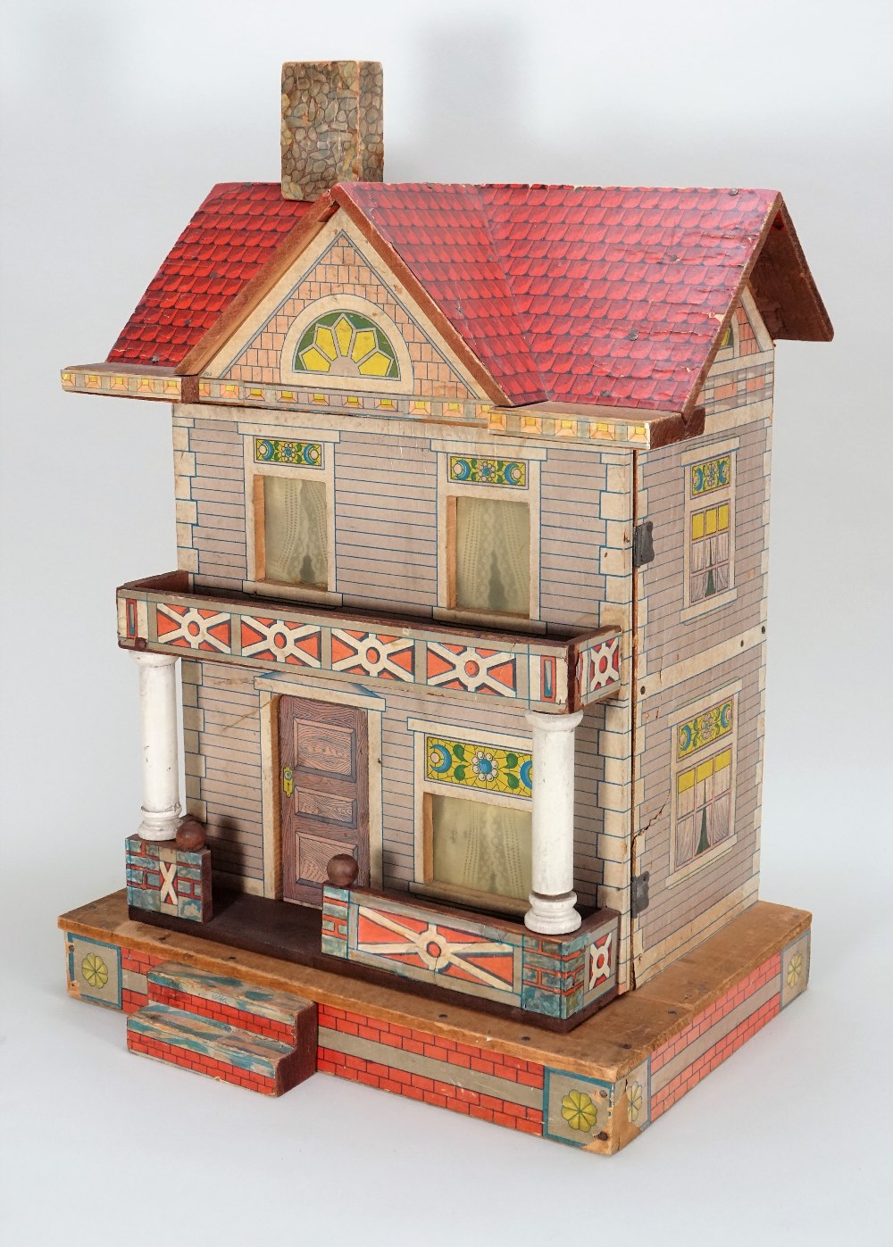 A charming R.Bliss wooden and paper lithographed Dolls House, circa 1911,