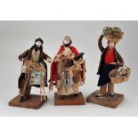 Three early Peddler dolls in glass fronted case, by C&H White, Milton, Portsmouth, 1820s,