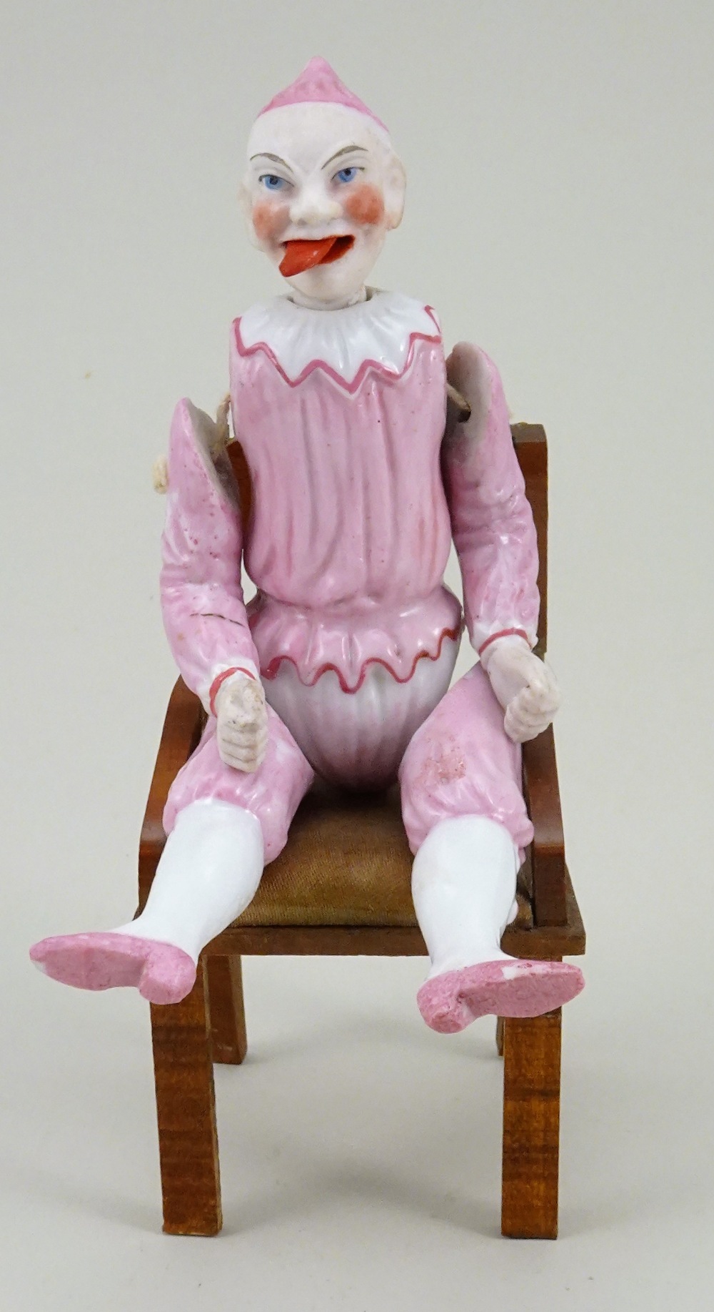 A rare all-bisque Clown with moving tongue, German 1870s,
