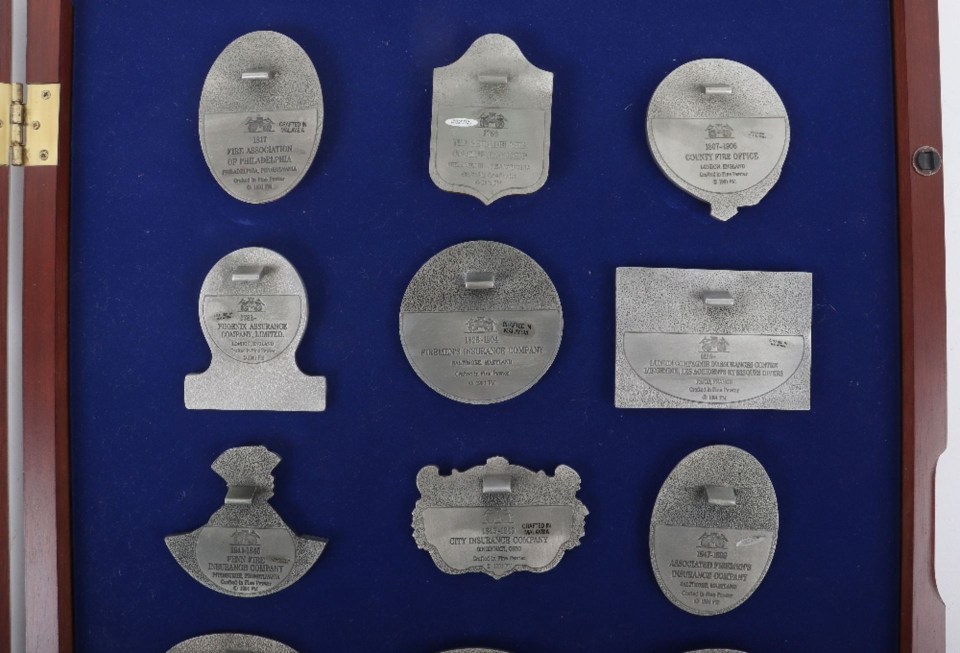 Fifteen Fine pewter fire insurance plaques, mounted in glass case - Image 4 of 5