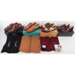 Four pairs of boxed men’s shoes