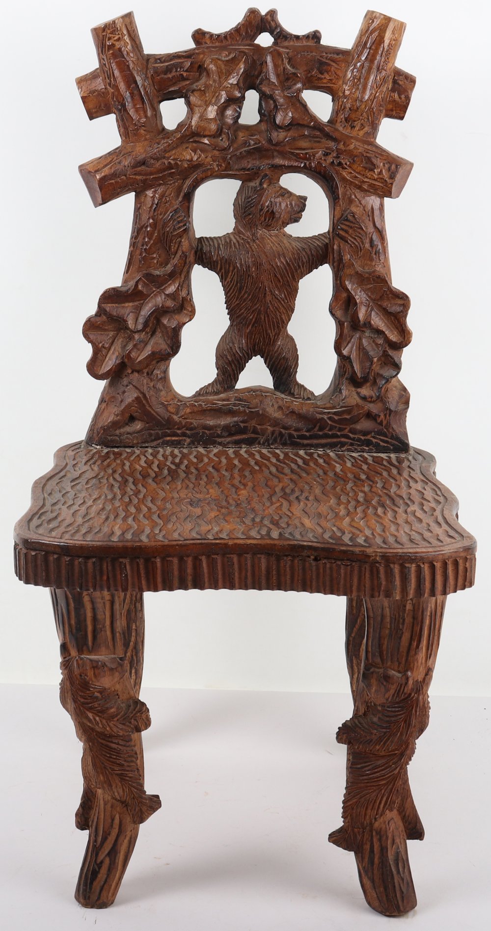 A Black Forest carved child’s chair