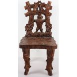 A Black Forest carved child’s chair
