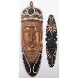 Tribal: A Papua New Guinea Sepik river region tribal mask, with another smaller