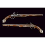 An elegant pair of long flintlock pistols