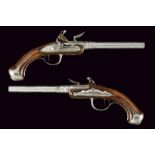 A rare pair of turn-off barrel Queen Anne type flintlock pistols by Chasteau