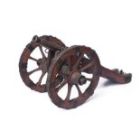 A cannon model with royal emblem