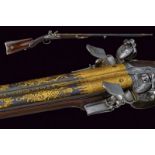 A silver mounted double barrelled flintlock gun from the manufacture of Versailles