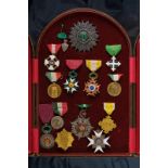 A display case with fourteen decorations and medals