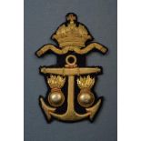 A navy badge