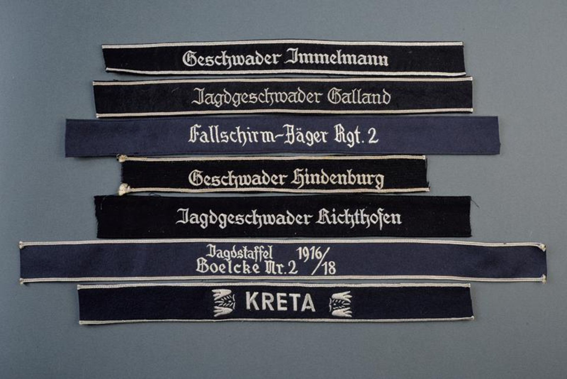 A lot of seven air force cuff titles (replica)