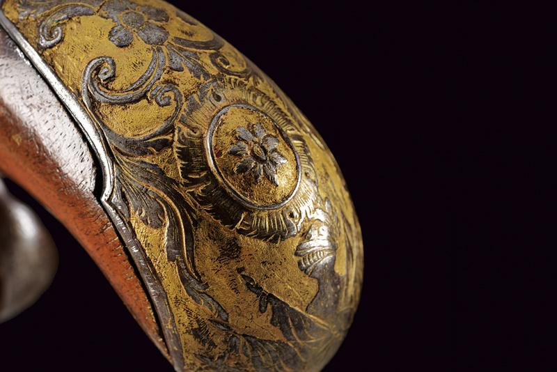 A rare engraved and gilded pair of Queen Anne flintlock pistols by G. Massin - Image 11 of 13