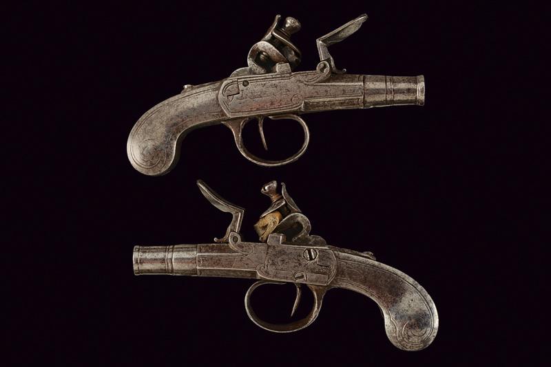 A pair of all-iron flintlock travel pistols