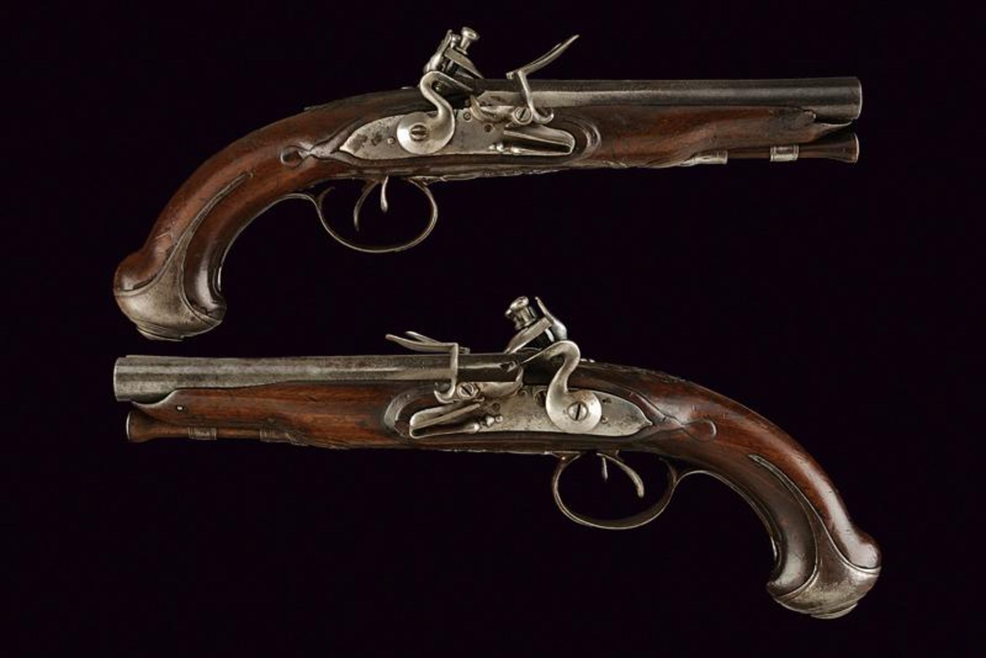 A pair of double barrelled flintlock pistols