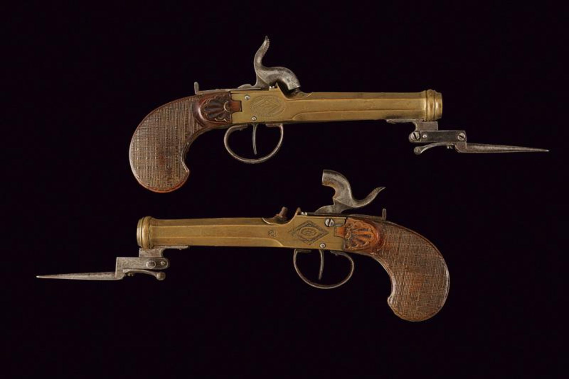A pair of marine percussion boxlock pistols with bayonet