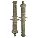 A very scarce pair of bronze cannons dated and with a coat of arms at the breach