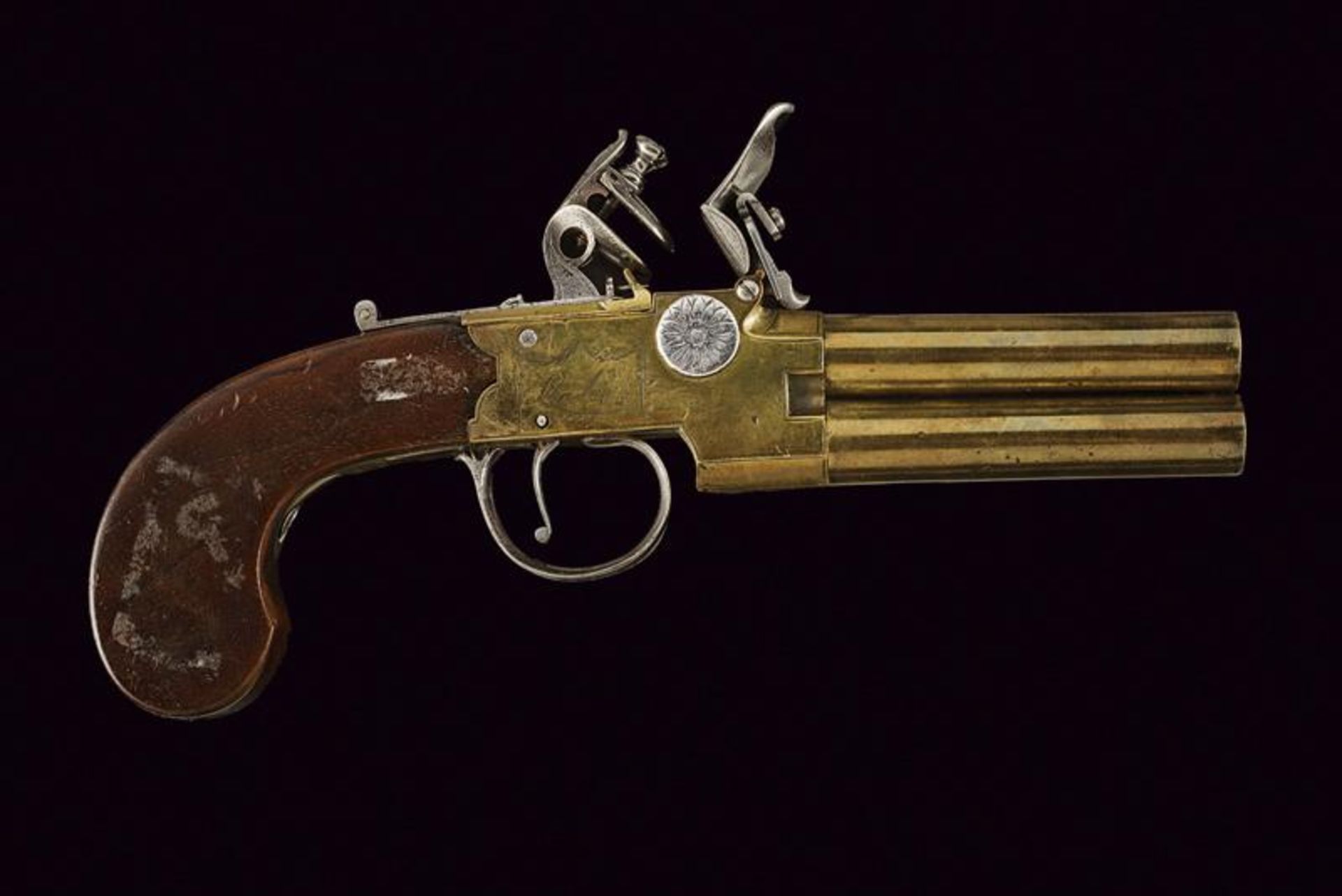 A double barrelled navy flintlock pocket pistol