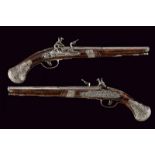 A beautiful and important pair of flintlock pistols, attributed to Ponsino Valet Borgognone