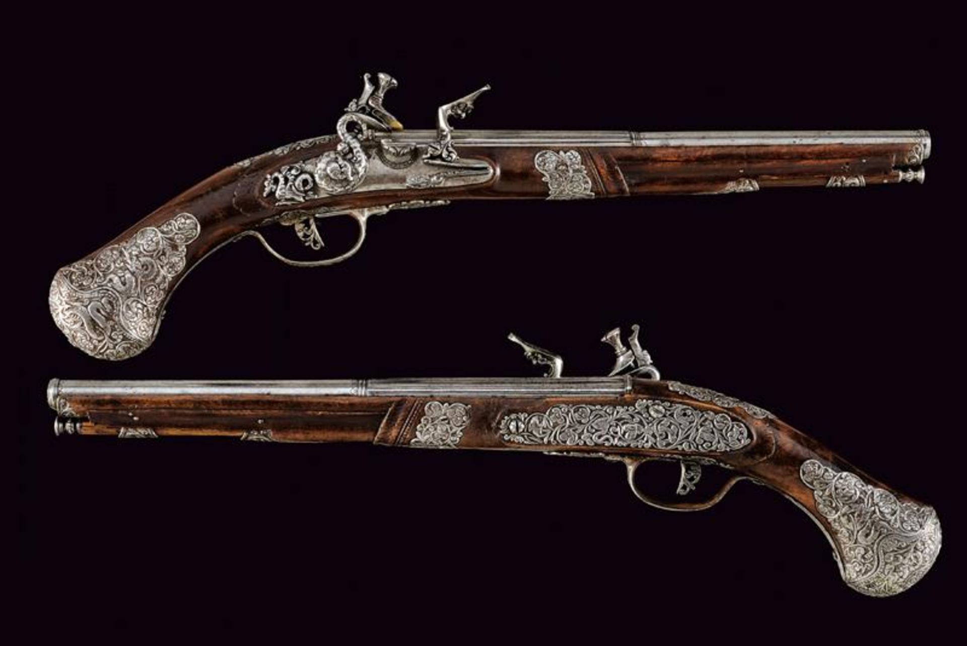 A beautiful and important pair of flintlock pistols, attributed to Ponsino Valet Borgognone