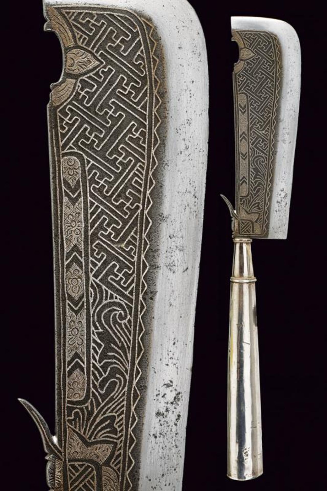 A ceremonial axe with silver hilt