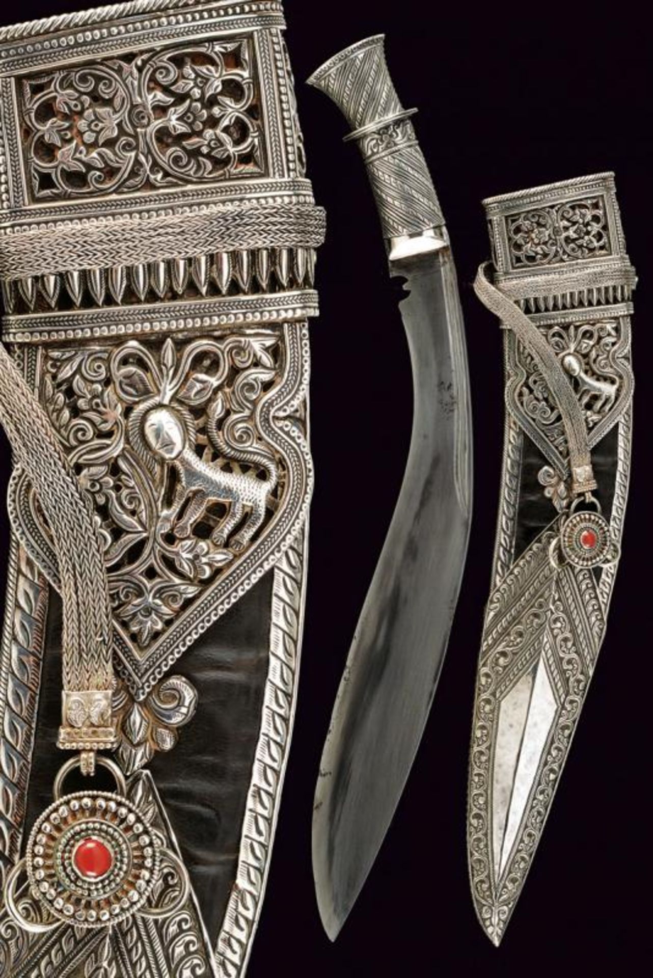 A beautiful silver mounted kukri with belt