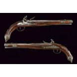 A pair of silver mounted flintlock pistols