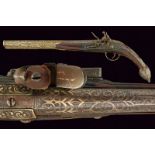 A rare flintlock pistol for a left handed gentleman