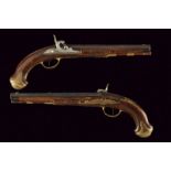 A pair of pistols by Jacob Kuchenreuther converted to percussion