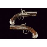 A pair of silver mounted travel pistols converted to percussion