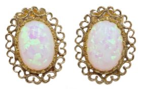 Pair of 9ct gold, filigree set opal stud earrings,