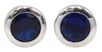 Pair of 9ct white gold blue stone set earrings,