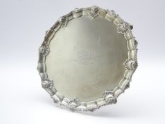 Edwardian silver circular salver with shell moulded border,