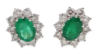 Pair of 18ct gold emerald and diamond cluster stud earrings, hallmarked,