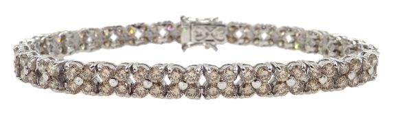 White gold diamond flower design line bracelet stamped 18K, total diamond weight 10.